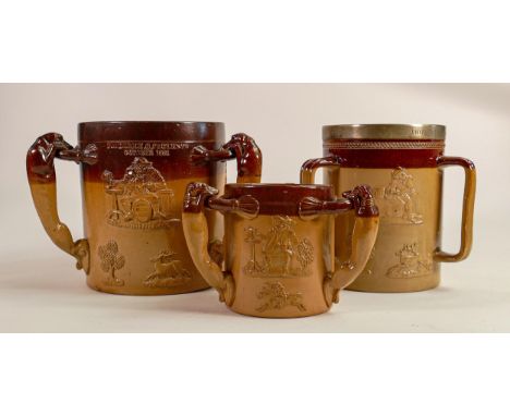 Three large Doulton Lambeth embossed Tygs with hound handles and rural country themes, the item with the silver plated collar