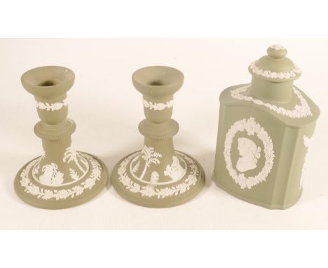 Wedgwood sage green candlesticks &amp; tea caddy, height of tallest 16.5cm. (3) 
