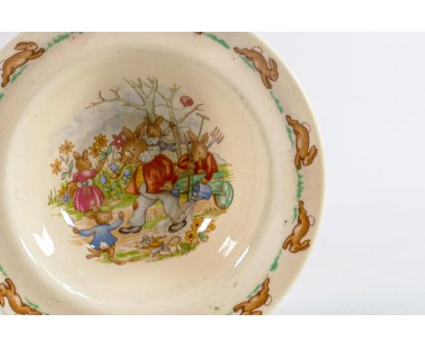 Royal Doulton Bunnykins items to include - cups and saucers, loose cups, egg cups, bowls, money boxes &amp; two tier cake sta