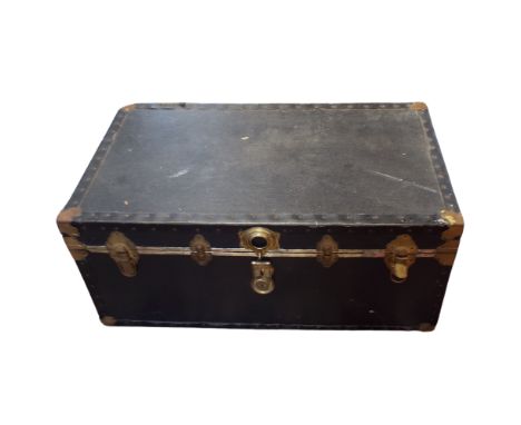 A large early 20th brass bound travel trunk, height 41cm width 92cm depth 54cm.