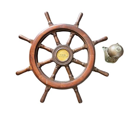 A large 20th century mahogany eight spoke ships wheel with brass plaque to hub A Success, diameter 102cm together with a nove