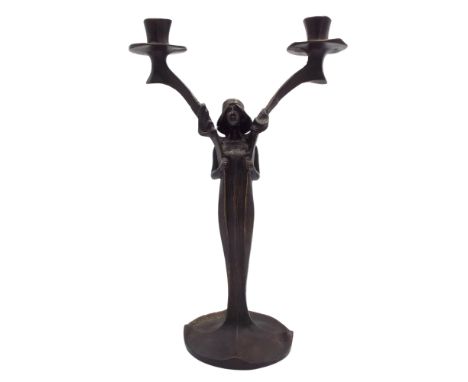 A French Art Nouveau bronze twin branch figural candlestick by J. Moigniez 1902 height 33cm.