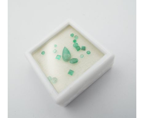Parcel of unmounted emeralds in mixed sizes and cuts (incl pear, oval, round and square step) boxed. 2.65ct total. 0.5g.