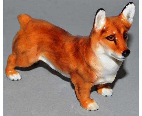 A ROYAL DOULTON MODEL OF A STANDING CORGI. 