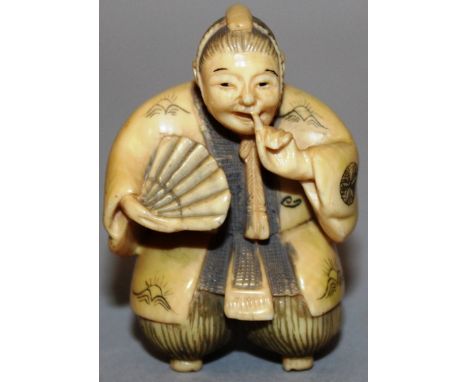 A JAPANESE NETSUKE, a woman holding a fan. Signed 1.75ins. 