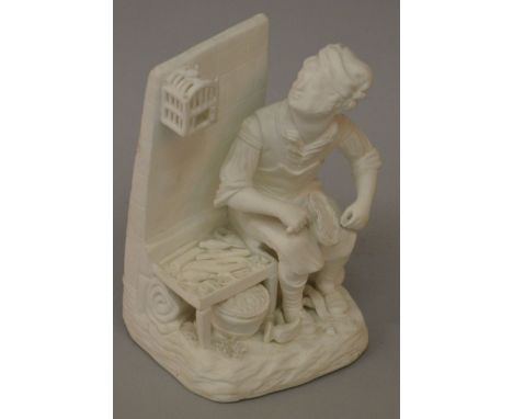 A 19TH CENTURY ROCKINGHAM FIGURE OF A COBBLER seated beside his tools. 