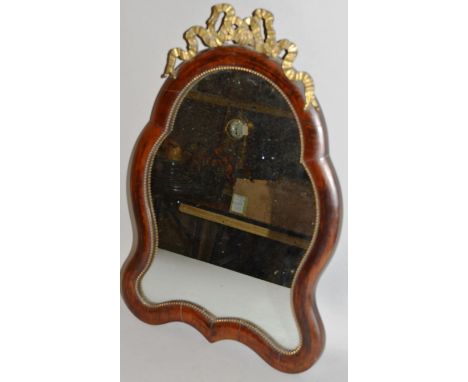 A ROSEWOOD SHAPED EASEL MIRROR. 18ins high. 