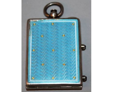 AN EDWARDIAN SILVER AND LIGHT BLUE ENAMEL COMPACT with two cabouchon stones Stamped .925. 