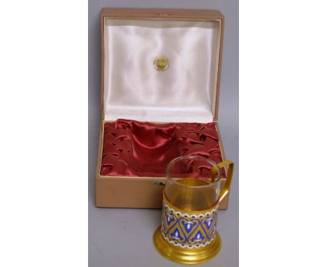 A RUSSIAN GILT AND ENAMEL MUG with glass liner, in original box. 