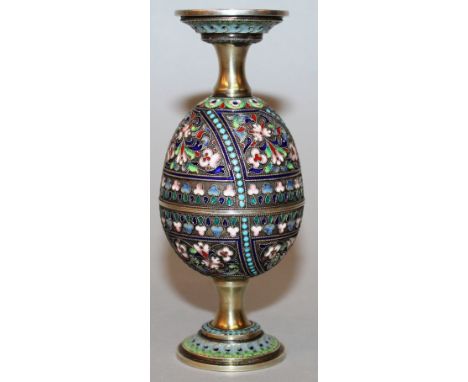 A RARE RUSSIAN SILVER AND ENAMEL EGG (which opens up “on put together form” a pair of cups with screw on bases), 2.5ins, Mark