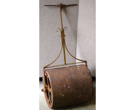 AN OLD WROUGHT IRON GARDEN ROLLER. 