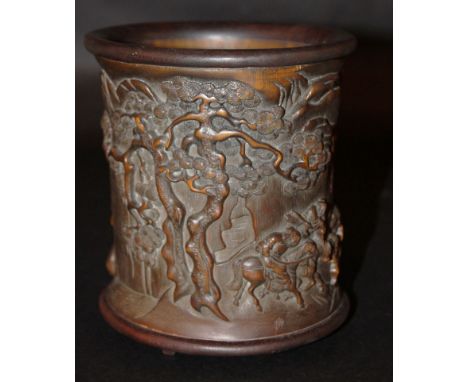 A CHINESE WOOD TRIPOD BRUSHPOT, the sides decorated with sages and warriors in a mountainous landscape, the side also with tw