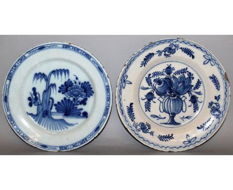 TWO DUTCH DELFTWARE BLUE AND WHITE CIRCULAR PLATES, floral decoration. 9ins diameter. 