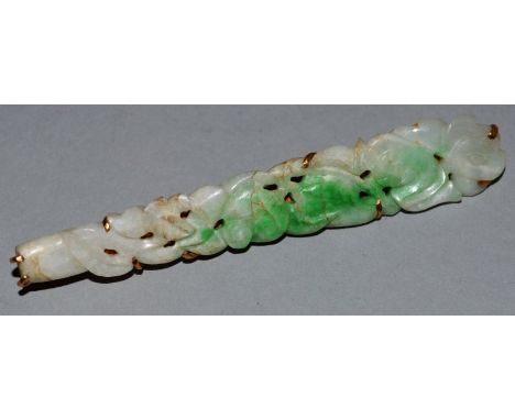 A GOOD CARVED AND PIERCED GOLD MOUNTED JADE LONG BROOCH in original box 3ins long. 