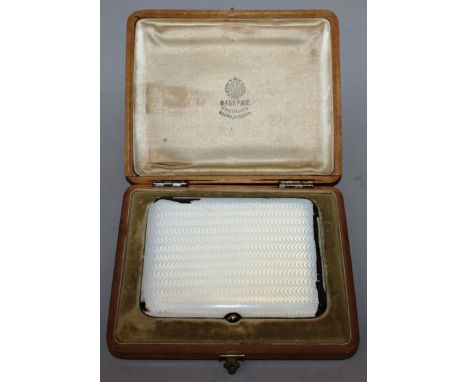 A RUSSIAN SILVER AND ENAMEL FABERGE COMPACT by ANDERS NEVALAINEN (1858-1933), the inside engraved with coronet and MY entwine