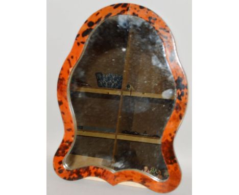 A TORTOISESHELL SHAPED EASEL MIRROR. 17ins high. 
