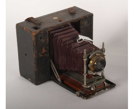 A large format vintage Eastman Kodak bellows camera, the lens mount stamped "PATENTED JANY. 5. 1897"