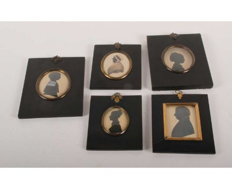 A collection of five various Victorian silhouette portrait miniatures, each housed in an ebonised frame
