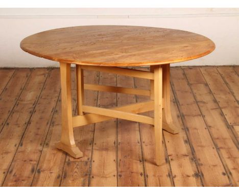 An Ercol blonde elm Windsor drop leaf dining tablew.128cm, each leaf 58cm