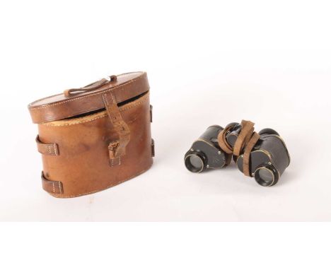 A pair of WW1 binoculars, dated 1916, cased