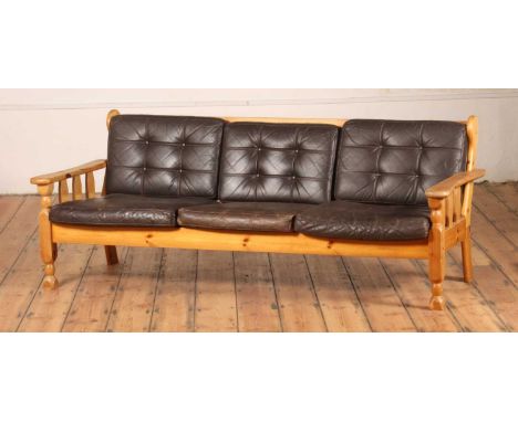 A Danish brown leather upholstered pine three-seater sofaw.186cm