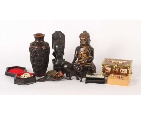 A collection of mainly Asian carved items, including a gilt Buddha figure, boxes, a pipe, and a vase