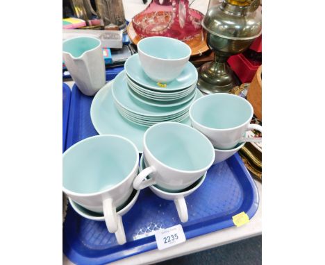 A Poole pottery twin tone part tea service, comprising six cups and saucers, six side plates, dinner plate, milk jug and suga