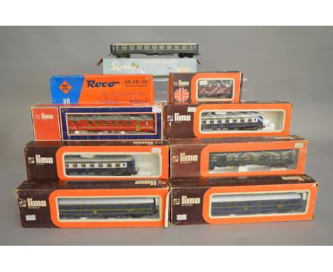 HO Gauge. A boxed Roco 04151B BR215 Diesel Locomotive, appears VG  in G box together with 7 boxed Coaches and a Wagon by Lima
