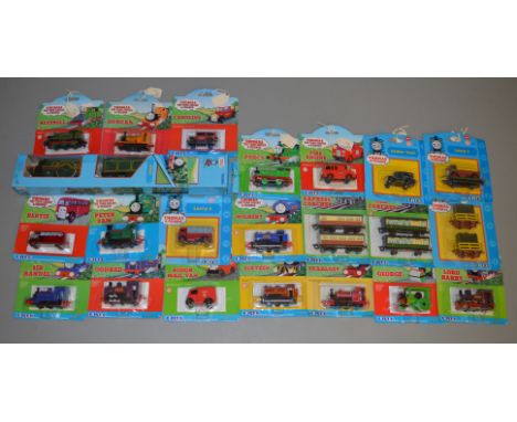 21 carded ERTL 'Thomas the Tank Engine' diecast models including 'Lord Harry' loco, 'Lorry 1', 'Fire Engine', 'Sodor Taxi' et