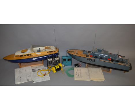 2 remote control boats; K.D. Perkasa which is approx 95cm in length with a stand, instructions and plans and Huntsman 31 whic