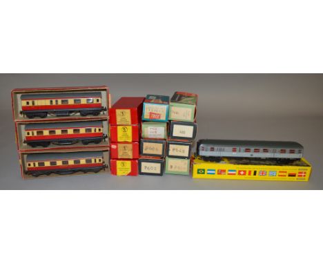 HO/OO Gauge. 3 boxed TTR Coaches, 9 Trix Wagons and three Home Colour Light Signals, also boxed, together with a Trix Express