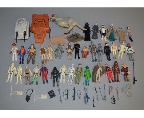 35 loose Star Wars vintage figures which includes weapons, a Taun Taun and some vehicles