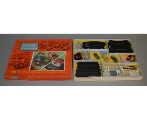 A boxed Tri-ang Minic Motorways Set, M.1526 3 Line Racing, the box includes three cars, track, hand controllers, building sec