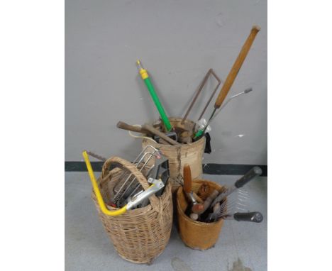 Three baskets of assorted garden tools, hand tools, hose attachments etc 