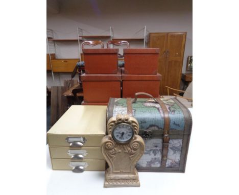 A storage box depicting map of the world together with two further sets of three graduated storage boxes, contemporary mantel