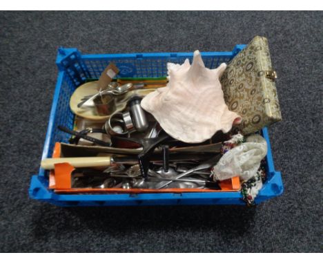 A basket of large shell, plated cutlery and napkin rings, silver napkin ring and three silver spoons, lady's watches etc 