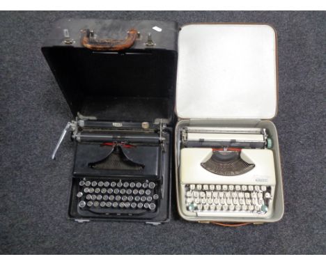 A cased vintage Royal typewriter together with a further brown leather cased Olympia Splendid 66 typewriter 