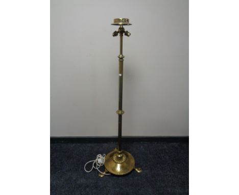 A brass Art Nouveau rise and fall two-way standard lamp 