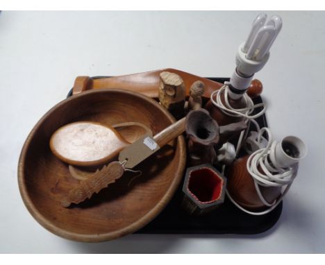 A tray of 20th century treen, lamp bases, animal carvings, wooden fruit bowl etc 