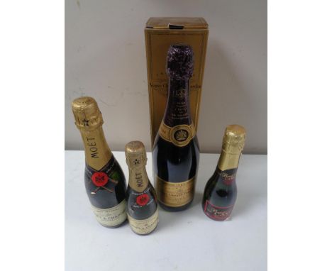 A bottle of Veuve Clicquot Ponsardin vintage reserve champagne, 1989, in presentation box, together with three further bottle