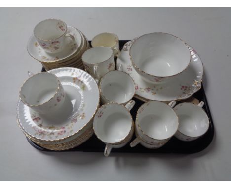 A tray of thirty-nine piece 19th century floral white and gilt tea service 