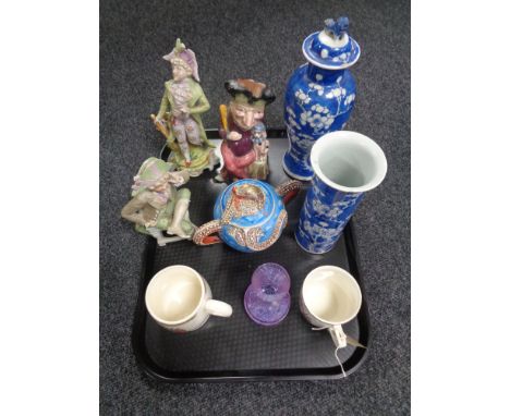 A tray of continental figurines, Japanese lidded sugar bowl, Caithness vase, Melba ware, Mr Punch jug, commemorative mugs, Ch