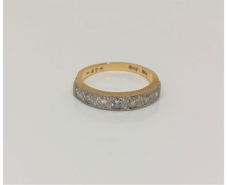 An 18ct gold seven stone half eternity diamond ring, approximately 0.5ct, size M/N.