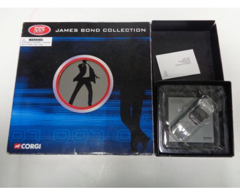 A Corgi James Bond collection film canister eight piece die-cast set (boxed) together with a further Corgi Jaguar E-type 40th