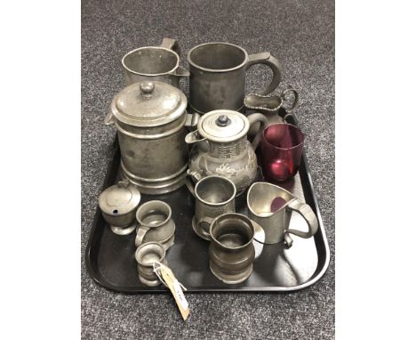 A tray of eleven assorted pieces of antique pewter ware, tankards, measures, Chinese teapot depicting a dragon etc 