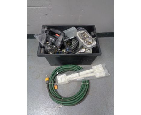 A plastic box of hose pipe, brass lion mask door knocker, paint stripper, Black and Decker jigsaw etc 