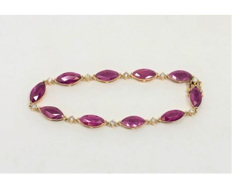 A 14ct yellow gold ruby and diamond bracelet, set with ten marquise-cut rubies (14.47 carats) and ten brilliant-cut diamonds 