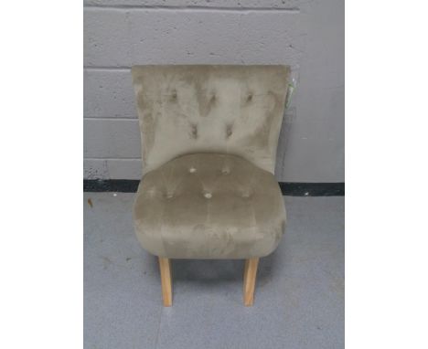 A contemporary button back bedroom chair 