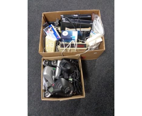 Two boxes of assorted electricals, Freesat boxes with remotes, vintage clock radio, extensions leads, telephones, Nokia mobil