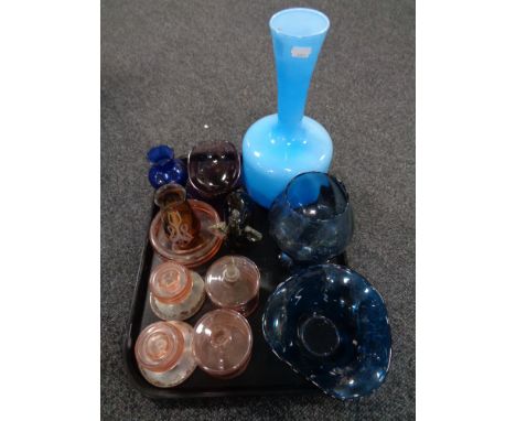 A tray of twentieth century coloured glass, pink five piece dressing table set, Caithness vase, Elephant paperweight etc 